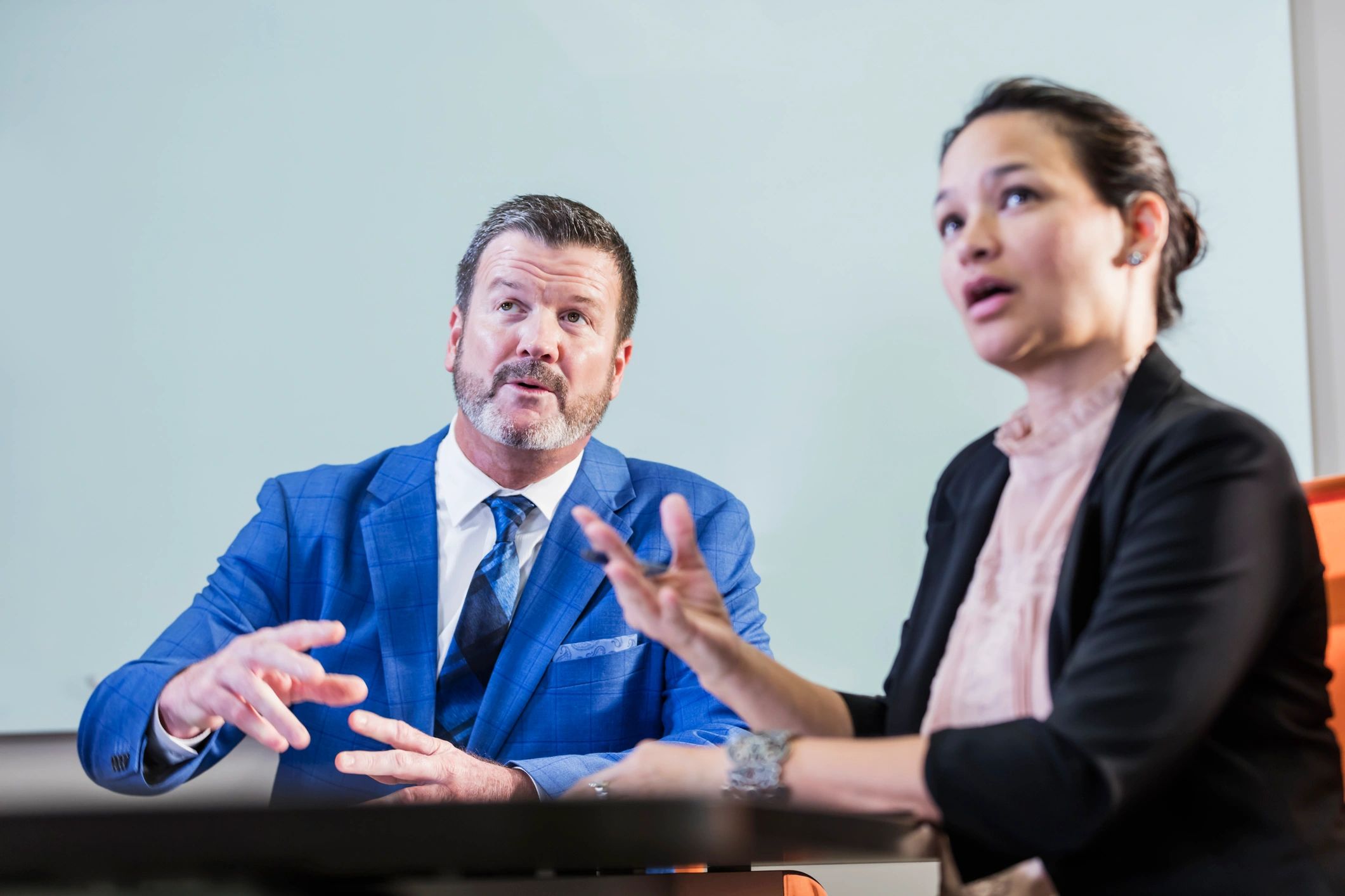Professional interview conversation in a boardroom