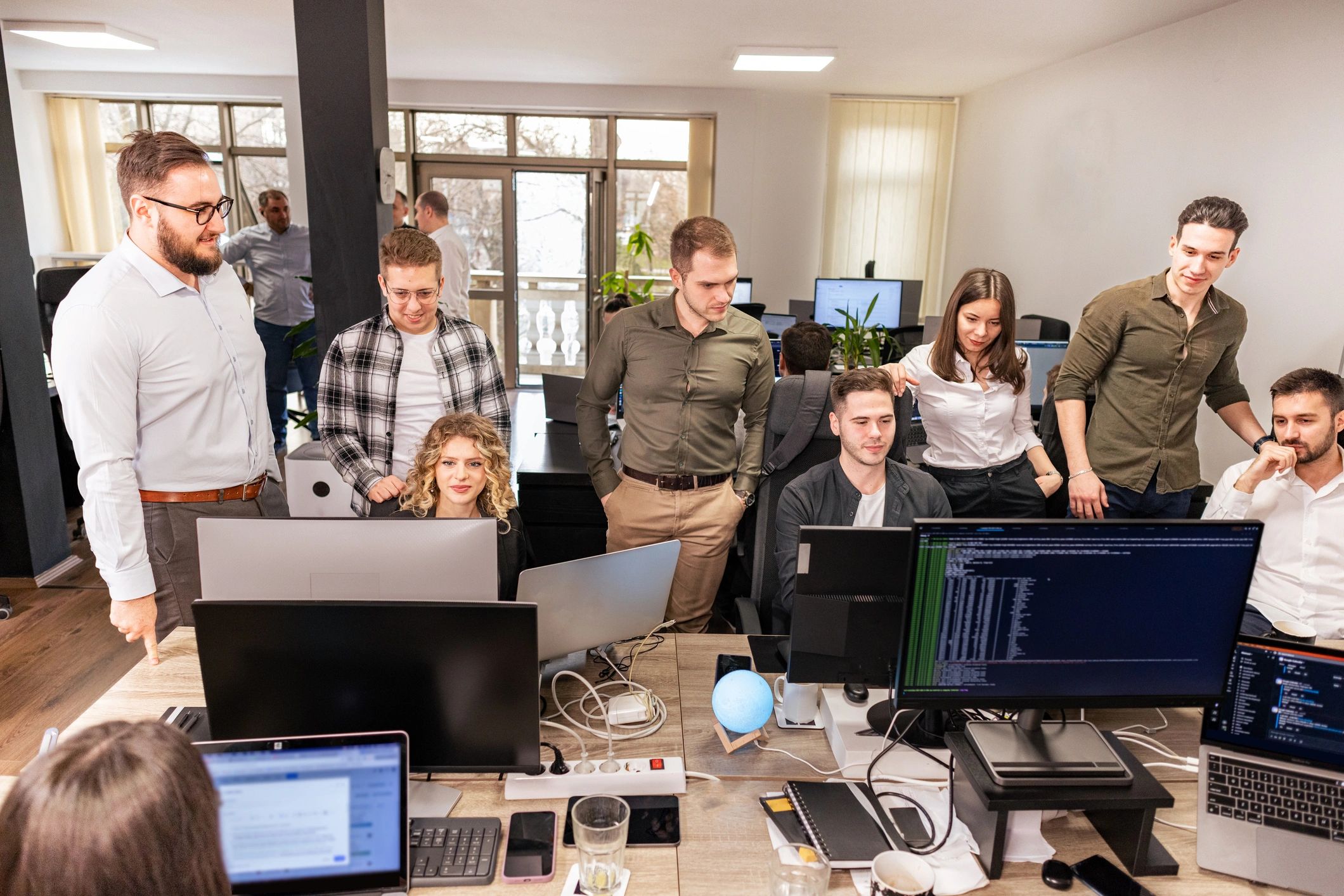 Technology team working together in an open office