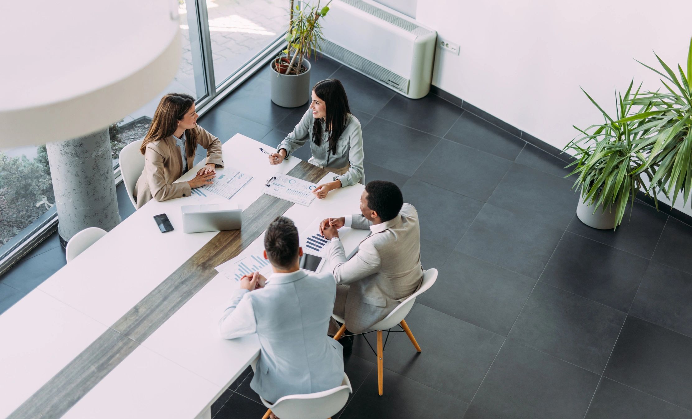 Business team gathered around a boardroom table