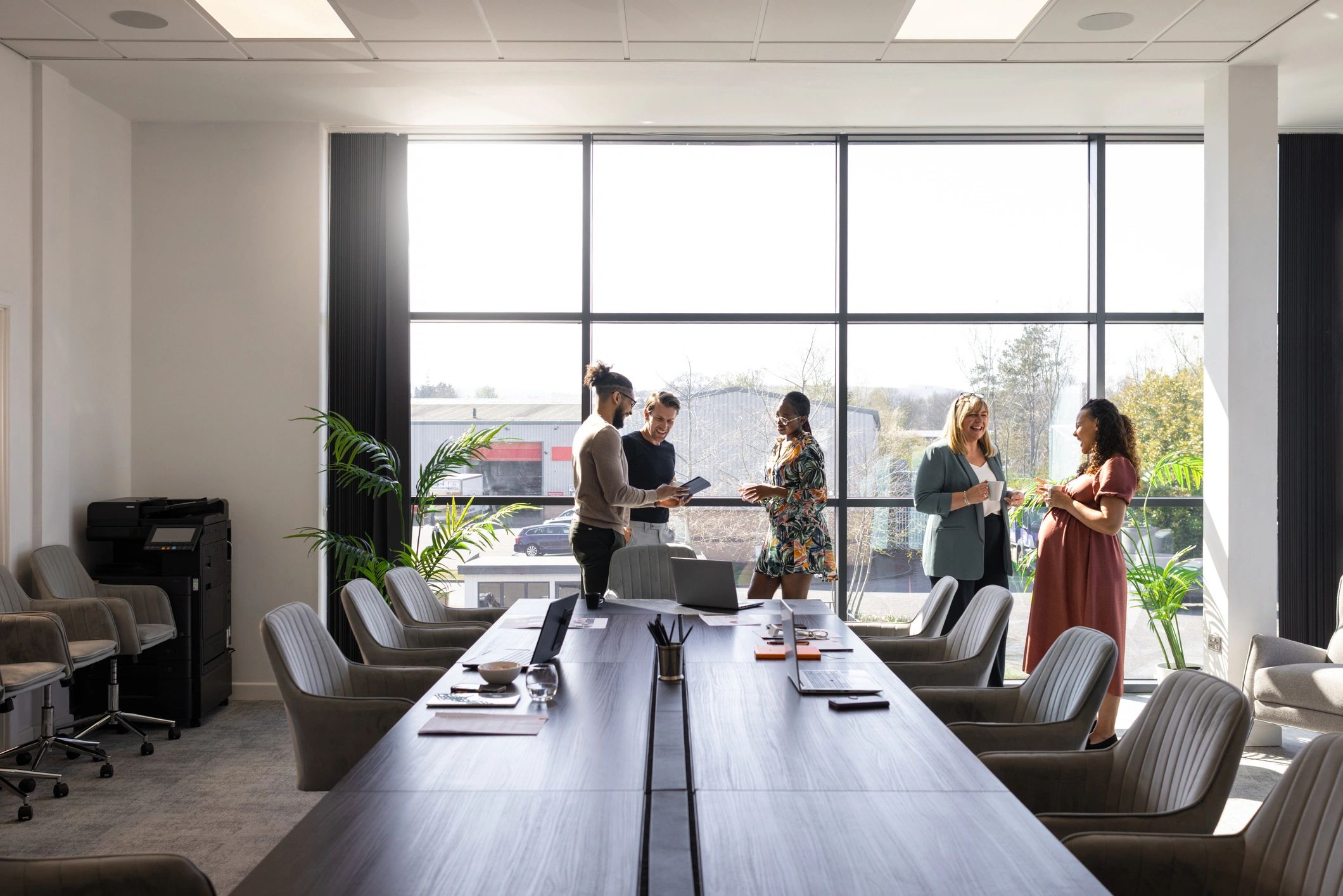 Business colleagues discussing work in a conference room